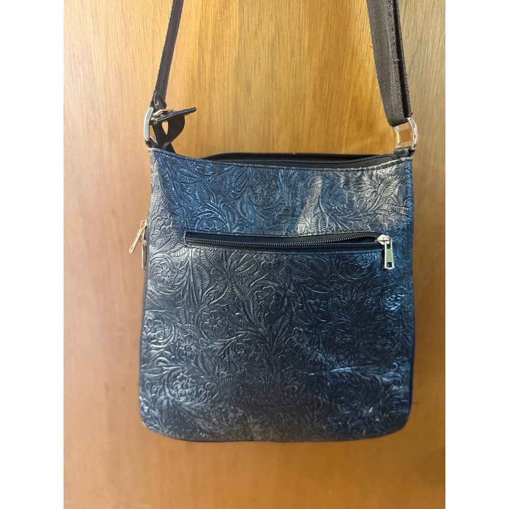 Selling my lovely BOTWANA black leather crossbody bag! It features a beautiful e